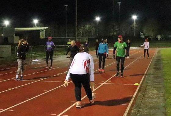 Ware Joggers members stretching together after a club session