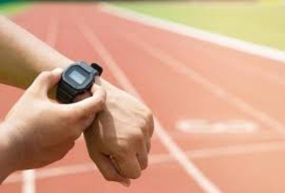 Close-up of a GPS running watch showing heart rate zones